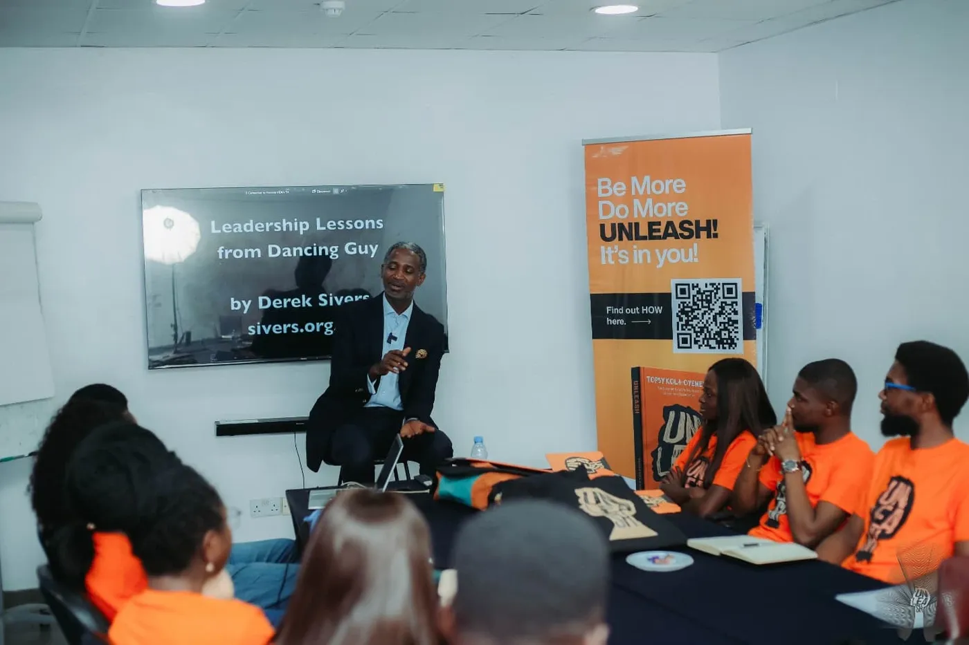 Kola Oyeneyin leading a fireside session for Envoys